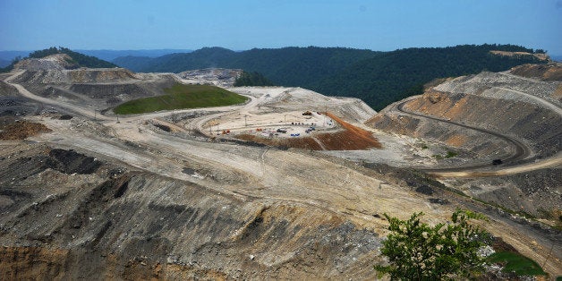 A June 12, 2008 general view shows a coal mine on top of Kayford Mountain in West Virginia. The mountain top has been demolished during the process to extract coal. Mountaintop removal mining (MTR), referred to in coal the industry as mountaintop mining/valley fills is surface mining involving extreme change to the summit or summit ridge of a mountain. It is used mainly with coal mining in the Appalachian Mountains, in the eastern US. The process involves using explosives to remove up to 1,000 vertical feet (304.8 meters) of rock to get to the coal. The debris is often moved into the adjacent river valleys, called a valley fill. AFP PHOTO/Mandel NGAN (Photo credit should read MANDEL NGAN/AFP/Getty Images)