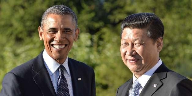 US President Barack Obama (L) is greeted by Chinese President Xi Jinping for a bilateral meeting in Saint Petersburg on Septe