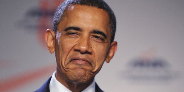 US President Barack Obama, speaking of receiving injections, frowns while addressing the American Nurses Association House of