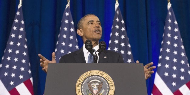 US President Barack Obama speaks about the National Security Agency (NSA) and intelligence agencies surveillance techniques at the US Department of Justice in Washington, DC, January 17, 2014. Obama trimmed the powers of the secretive US eavesdropping agency Friday by calling for new privacy safeguards, but allowed bulk phone data sweeps to continue as an anti-terror tool. In a long-awaited speech outlining changes to programs exposed by Edward Snowden, Obama also said he had halted National Security Agency (NSA) spy taps targeting friendly world leaders. AFP PHOTO / Jim WATSON (Photo credit should read JIM WATSON/AFP/Getty Images)