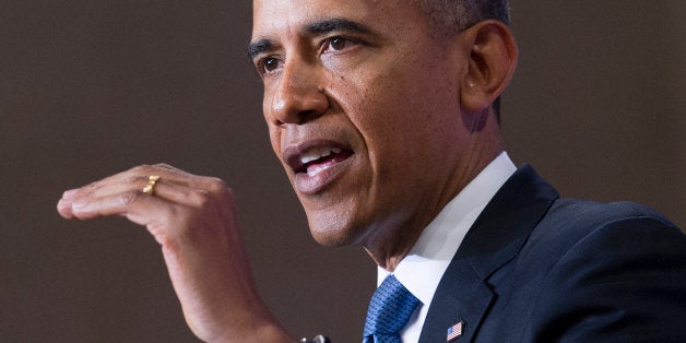 US President Barack Obama speaks about the National Security Agency (NSA) and intelligence agencies surveillance techniques at the US Department of Justice in Washington, DC, January 17, 2014. Obama trimmed the powers of the secretive US eavesdropping agency Friday by calling for new privacy safeguards, but allowed bulk phone data sweeps to continue as an anti-terror tool. In a long-awaited speech outlining changes to programs exposed by Edward Snowden, Obama also said he had halted National Security Agency (NSA) spy taps targeting friendly world leaders. AFP PHOTO / Jim WATSON (Photo credit should read JIM WATSON/AFP/Getty Images)