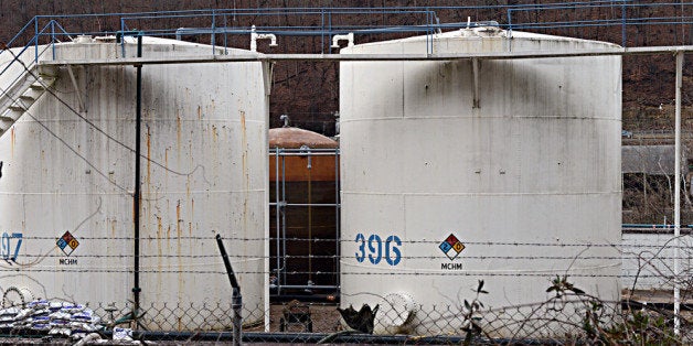 CHARLESTON, WV - JANUARY 10: Leaking MCHN tanks at Freedom Industries are being off loaded into tanker trucks on January 10, 2014 in Charleston, West Virginia. West Virginia American Water determined Thursday MCHM chemical had 'overwhelmed' the plant's capacity to keep it out of the water from a spill at Freedom Industries in Charleston. An unknown amount of the hazardous chemical contaminated the public water system for potentially 300,000 people in West Virginia. (Photo by Tom Hindman/Getty Images)