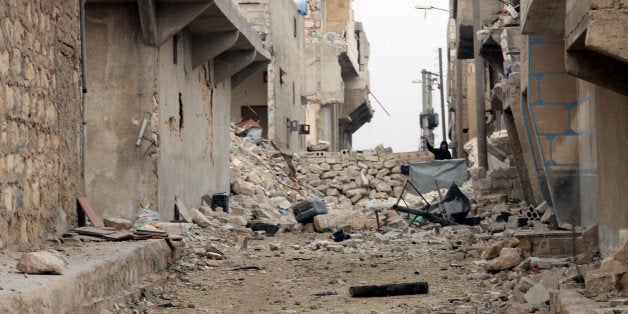 ALEPPO, SYRIA - JANUARY 25: Many houses are demolished and many others are damaged in a barrel bomb attack staged by Assad regime helicopters near a military airport in Karm Al Jabal district of Aleppo, Syria on January 25. (Photo by Salih Mahmud Leyla/Anadolu Agency/Getty Images)