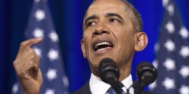 US President Barack Obama speaks about the National Security Agency (NSA) and intelligence agencies surveillance techniques at the US Department of Justice in Washington, DC, January 17, 2014. Obama trimmed the powers of the secretive US eavesdropping agency Friday by calling for new privacy safeguards, but allowed bulk phone data sweeps to continue as an anti-terror tool. In a long-awaited speech outlining changes to programs exposed by Edward Snowden, Obama also said he had halted National Security Agency (NSA) spy taps targeting friendly world leaders. AFP PHOTO / Jim WATSON (Photo credit should read JIM WATSON/AFP/Getty Images)