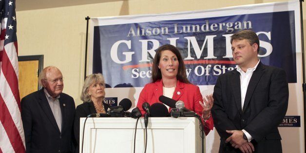 Secretary of State Alison Lundergan Grimes announces she will seek the Democratic nomination to challenge Republican U.S. Sen. Mitch McConnell in 2014, during an afternoon news conference in Frankfort, Kentucky, July 1, 2013. She is flanked by former Kentucky Governors Julian Carroll, from left, and Martha Layne Collins and her husband Andrew Grimes on the right. (Charles Bertram/Lexington Herald-Leader/MCT via Getty Images)