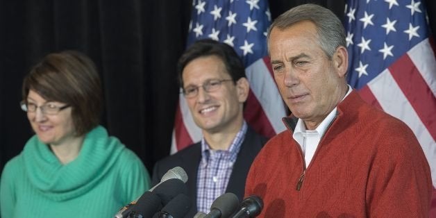 Speaker of the House John Boehner (R), R-Ohio, speaks during the House Republican Leadership press conference at the House Republican Issues Conference in Cambridge, Maryland, January 30, 2014, with Majority Leader US Congressman Eric Cantor (C), R-Virginia, and Conference Chair Cathy McMorris Rodgers, R-Washington. AFP PHOTO / Jim WATSON (Photo credit should read JIM WATSON/AFP/Getty Images)