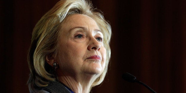 WASHINGTON, DC - DECEMBER 06: Former U.S. Secretary of State Hillary Clinton delivers remarks after being presented the 2013