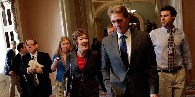 WASHINGTON, DC - OCTOBER 16: Sen. Susan Collins (R-ME) and Sen. Jeff Flake (R-AZ) arrive for a meeting of Senate Republicans on a solution for the pending budget and debt limit impasse at the U.S. Capitol October 16, 2013 in Washington, DC. The U.S. government shutdown is in its sixteenth day as the U.S. Senate and House of Representatives remain gridlocked on funding the federal government and the extending the nation's debt limit. (Photo by Win McNamee/Getty Images)