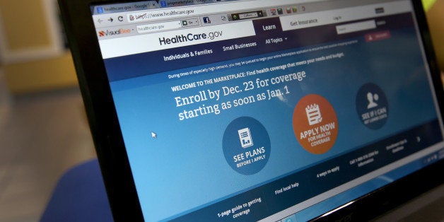 MIAMI, FL - DECEMBER 22: A computer screen reads, 'Enroll by Dec. 23 for coverage starting as soon as Jan 1.' as agents from