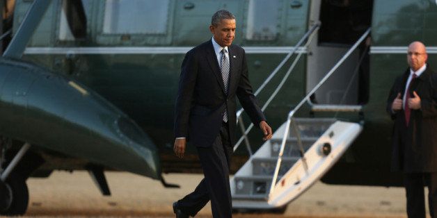 WASHINGTON, DC - FEBRUARY 07: U.S. President Barack Obama walks across the South Lawn after returning to the White House after a daytrip to Michigan February 7, 2014 in Washington, DC. Obama traveled to Michigan where he signed the $965 billion Agriculture Act of 2014 into law. (Photo by Chip Somodevilla/Getty Images)