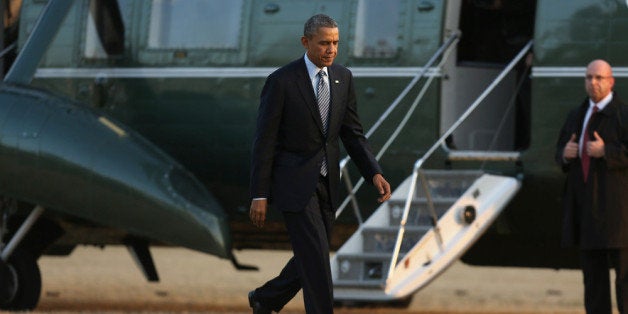 WASHINGTON, DC - FEBRUARY 07: U.S. President Barack Obama walks across the South Lawn after returning to the White House aft