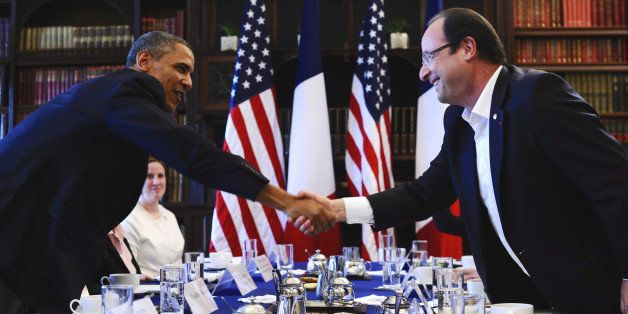 US President Barack Obama (L) shakes hands with French President Francois Hollande (R) during a bilateral meeting on the sidelines of the G8 summit in the Lough Erne resort near Enniskillen, Northern Ireland on June 18, 2013. Russia and the US agreed at the G8 summit to push for Syria peace talks, but Presidents Vladimir Putin and Barack Obama made clear their deep differences over the conflict. AFP PHOTO / JEWEL SAMAD (Photo credit should read JEWEL SAMAD/AFP/Getty Images)