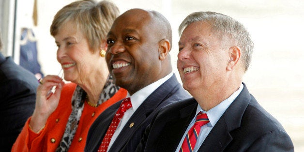 South Carolina Senators Tim Scott, center, and Lindsey Graham, right, listen as Gov. Nikki Haley speaks during the South Carolina Inland Port groundbreaking ceremony in Greer, South Carolina, Friday, March 1, 2013. More than 200 port users, stakeholders, community leaders and elected officials came together to break ground on the new site. (Gerry Melendez/The State/MCT via Getty Images)