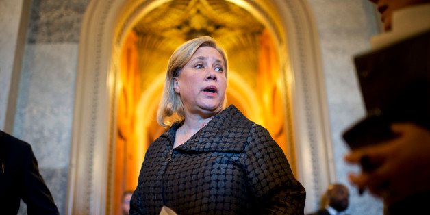UNITED STATES - JANUARY 30: Sen. Mary Landrieu, D-La., speaks with aides before a vote in the Capitol. (Photo By Tom Williams/CQ Roll Call)