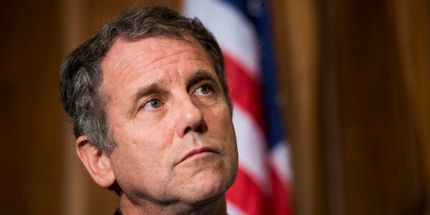 UNITED STATES - OCTOBER 9: Sen. Sherrod Brown, D-Ohio, listens as the Senate Veterans' Affairs Committee Democrats hold a news conference to highlight the impacts of the government shutdown on veterans on Wednesday, Oct. 9, 2013. (Photo By Bill Clark/CQ Roll Call)