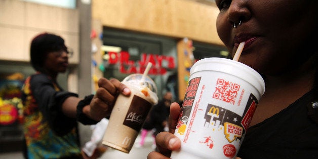 NEW YORK, NY - OCTOBER 17: Lori Middleton drinks a large soda on October 17, 2013 in the Brooklyn borough of New York City. New York's Court of Appeal has agreed to hear New York City's appeal of a lower court ruling that blocked Mayor Michael Bloomberg's campaign to stop fast food restaurants from selling super-sized, sugary drinks. In a recent ruling, which dealt a blow to the campaign to improve the health of New Yorkers, the lower court said the city Board of Health exceeded its authority by putting a 16-ounce size limit on high-calorie sodas and soft drinks. (Photo by Spencer Platt/Getty Images)