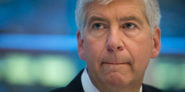 Rick Snyder, governor of Michigan, speaks during an interview in New York, U.S., on Friday, July 26, 2013. Snyder said he hopes to 'get through' the Detroit bankruptcy filing by 'the fall of next year.' Photographer: Scott Eells/Bloomberg via Getty Images