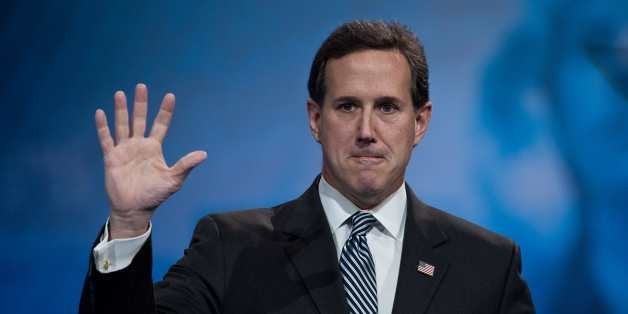 Former US Republican Senator from Pennsylvania Rick Santorum waves after speaking at the Conservative Political Action Confer