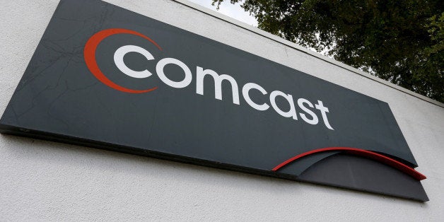 POMPANO BEACH, FL - FEBRUARY 13: A Comcast sign is seen at one of their centers on February 13, 2014 in Pompano Beach, Florida. Today, Comcast announced a $45-billion offer for Time Warner Cable. (Photo by Joe Raedle/Getty Images)