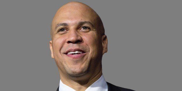 Cory Booker headshot, as US Senator of New Jersey, after ceremonial swearing-in ceremony, Capitol Hill, Washington, DC, graphic element on gray