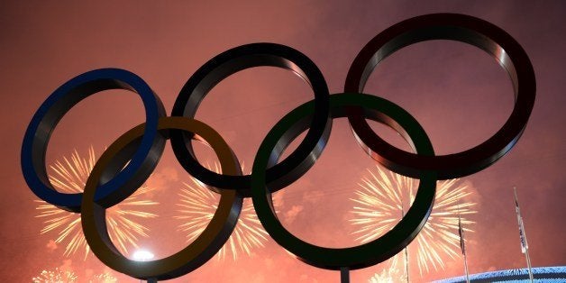 Fireworks explode around the Fisht Olympic Stadium at the end of the Closing Ceremony of the Sochi Winter Olympics on Februar
