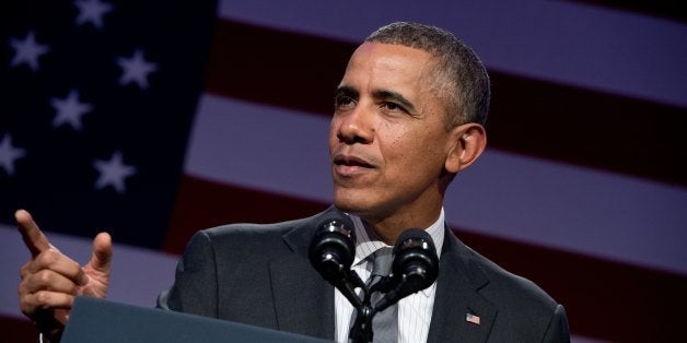 US President Barack Obama addresses the National Organizing summit in Washington on February 25, 2014. AFP PHOTO/Nicholas