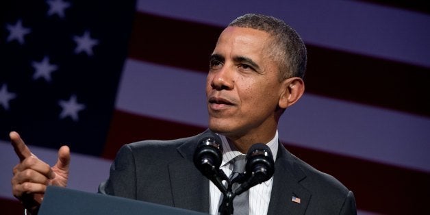 US President Barack Obama addresses the National Organizing summit in Washington on February 25, 2014. AFP PHOTO/Nicholas KAMM (Photo credit should read NICHOLAS KAMM/AFP/Getty Images)