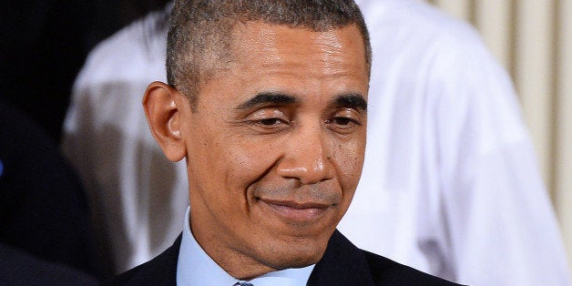 US President Barack Obama smiles before speaking on his My Brothers Keeper initiative in the East Room at the White House on February 27, 2014 in Washington, DC. Obama launched a passionate appeal to improve opportunities for minority youths, saying their plight was an 'outrage' that could easily have become his story. Obama cited statistics showing young Blacks and Hispanics in the US were, on average, disadvantaged throughout their lives. AFP PHOTO/Jewel Samad (Photo credit should read JEWEL SAMAD/AFP/Getty Images)