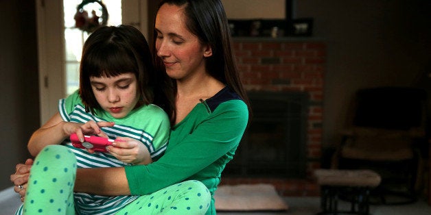 GEORGETOWN, MA - JANUARY 17: Jill Osborn hopes marijuana will help her daughter Haley, 7, with her seizures. Haley has a severe form of epilepsy and could have several dozen seizures in a day. A handful of studies suggest cannabidiol, or CBD, an ingredient in marijuana, might cut frequency of seizures. (Photo by Jonathan Wiggs/The Boston Globe via Getty Images)