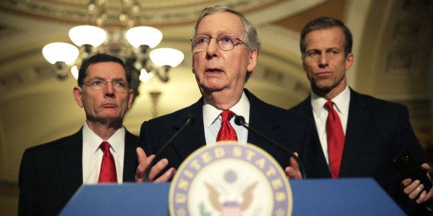 WASHINGTON, DC - MARCH 05: U.S. Senate Minority Leader Sen. Mitch McConnell (R-KY) (2nd L) speaks as Sen. John Barrasso (R-WY) (L) and Sen. John Thune (R-SD) (R) listen during a news briefing March 5, 2014 on Capitol Hill in Washington, DC. Senate GOP leaders spoke to members of the media after their weekly policy luncheon. (Photo by Alex Wong/Getty Images)