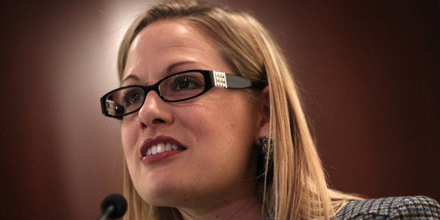 WASHINGTON, DC - OCTOBER 23: U.S. Rep. Kyrsten Sinema (D-AZ) speaks during a discussion on immigration reform October 23, 2013 on Capitol Hill in Washington, DC. The Dream Action Coalition held a rally and briefing to discuss 'how the outdated immigration system undermines military readiness, separates military families, and prevents talent from joining its enlisted and officer ranks.' (Photo by Alex Wong/Getty Images)