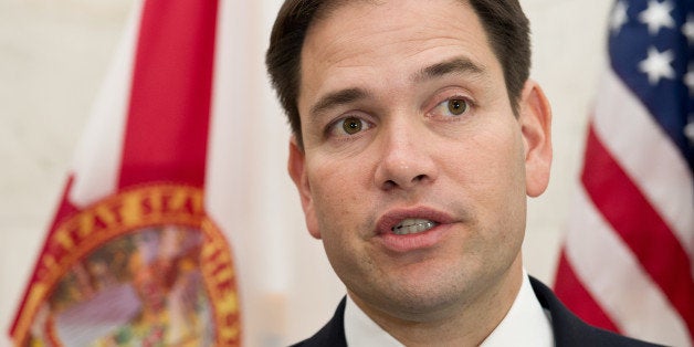 US Sen. Marco Rubio, R-Florida, speaks to reporters March 6, 2014 on Capitol Hill in Washington,DC after meetings with Venezuelan legislators and pro-democracy leaders regarding President Nicolás Maduros wave of repression that has left at least 18 peaceful demonstrators dead and hundreds more injured or unjustly imprisoned. Sen. Rubio met with Leomagno Flores, National Assemblyman for Tachira State, Member of the Foreign Affairs Standing Committee in the National Assembly, Member of the Democratic Unity Caucus (Unidad Democratica) and Americo de Grazia - National Assemblyman for Bolivar State, Member of the Foreign Affairs Standing Committee in the National Assembly, President of Causa R, Member of the Democratic Unity Caucus. AFP PHOTO / Karen BLEIER (Photo credit should read KAREN BLEIER/AFP/Getty Images)