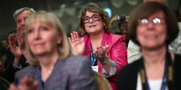 NATIONAL HARBOR, MD - MARCH 07: Audience members cheer for Texas Governor Rick Perry during the second day of the Conservati