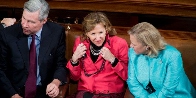 UNITED STATES - JANUARY 28: Sens. Sheldon Whitehouse, D-R.I., Kay Hagan, D-N.C., and Mary Landrieu, D-La., wait in the House Chamber of the Capitol to hear President Barack Obama deliver his State of the Union address. (Photo By Tom Williams/CQ Roll Call)