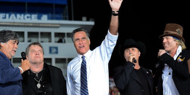 US Republican Presidential candidate Mitt Romney sings 'God Bless America' with singers (L-R) Randy Owen, Meat Loaf, John Rich and Big Kenny during a rally at Defiance High School, in Defiance, Ohio, October 25, 2012. AFP PHOTO/Emmanuel DUNAND (Photo credit should read EMMANUEL DUNAND/AFP/Getty Images)