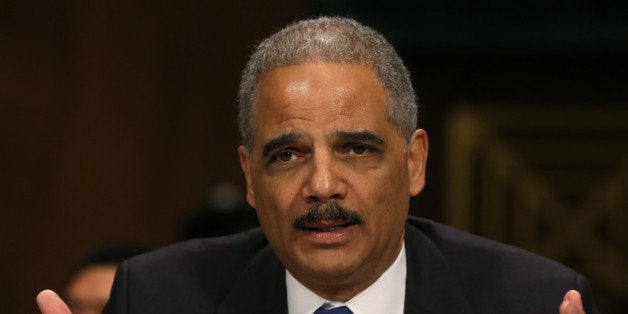 WASHINGTON, DC - JANUARY 29: Attorney General Eric Holder testifies during a Senate Judiciary Committee hearing on Capotil Hill, on January 29, 2014 in Washington, DC. The committee is hearing testimony on oversight of the Justice Department and reform of government surveillance programs. (Photo by Mark Wilson/Getty Images)