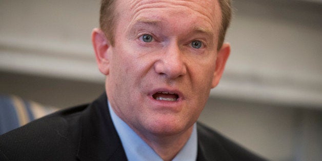 UNITED STATES - APRIL 24: Sen. Chris Coons, D-Del., conducts a briefing with reporters in his Russell office, on the re-introduction of the Master Limited Partnerships Parity Act. The legislation would give investors in renewable energy projects the same tax advantages that are enjoyed by investors in fossil fuel-based projects. (Photo By Tom Williams/CQ Roll Call)