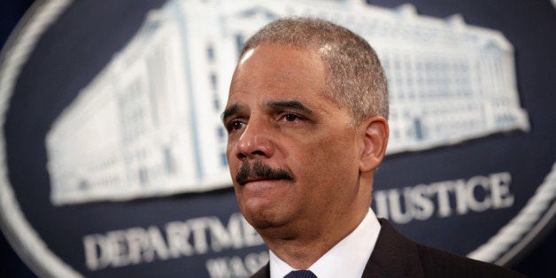 WASHINGTON, DC - MARCH 19: U.S. Attorney General Eric Holder listens during an announcement at the Justice Department March 19, 2014 in Washington, DC. The Justice Department announced a deferred prosecution agreement with a $1.2 billion fine regarding Toyota Motor Corporations misleading to its consumers on the unintended acceleration issues in the cars the company manufactured. (Photo by Alex Wong/Getty Images)