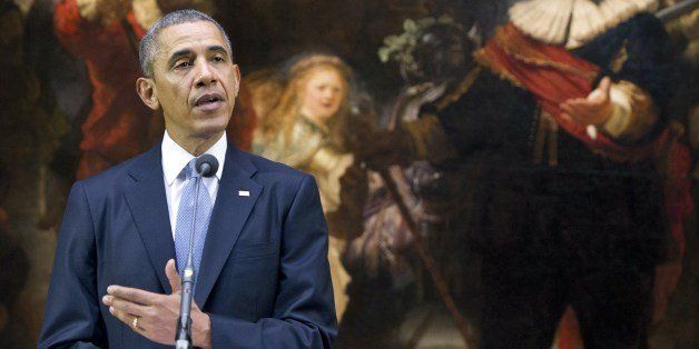 US President Barack Obama speaks in front of Rembrandt's 'Night Watch' during a joint press conference with the Dutch prime minister at the Rijksmuseum in Amsterdam on March 24, 2014 ahead of the Nuclear Security Summit (NSS). AFP PHOTO / Saul LOEB (Photo credit should read SAUL LOEB/AFP/Getty Images)