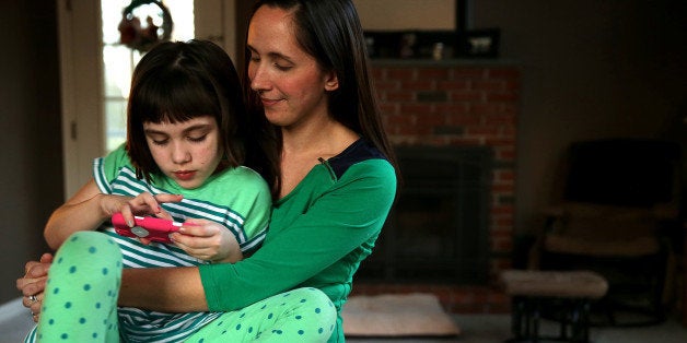 GEORGETOWN, MA - JANUARY 17: Jill Osborn hopes marijuana will help her daughter Haley, 7, with her seizures. Haley has a severe form of epilepsy and could have several dozen seizures in a day. A handful of studies suggest cannabidiol, or CBD, an ingredient in marijuana, might cut frequency of seizures. (Photo by Jonathan Wiggs/The Boston Globe via Getty Images)