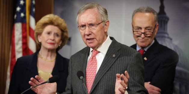 WASHINGTON, DC - MARCH 26: U.S. Senate Majority Leader Sen. Harry Reid (D-NV) (2nd L) speaks as Sen. Debbie Stabenow (D-MI) (L) and Sen. Charles Schumer (D-NY) (R) listen during a news conference March 26, 2014 on Capitol Hill in Washington, DC. Senate Democrats held a news conference to unveil 2014 agenda: 'A Fair Shot for Everyone,' including topics on minimum wage, equal pay for women, Medicare for seniors, job creation and small business development. (Photo by Alex Wong/Getty Images)