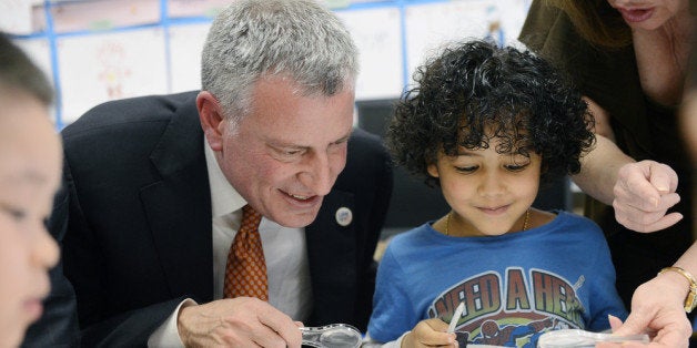 NEW YORK, NY - APRIL 03: New York City Mayor Bill de Blasio and student Justin De La Cruz work on a science project with worms during a visit to a pre-K classroom at P.S.1 on Henry St. in Manhattan on April 3, 2014 in New York City. Earlier de Blasio and Assembly Speaker Sheldon Silver announced a major media and community organizing push urging New Yorkers to sign their children up for pre-K. (Photo by Susan Watts-Pool/Getty Images)