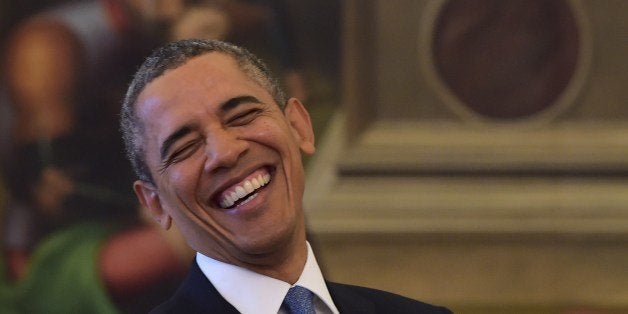 US President Barack Obama laughs during a private audience with Pope Francis on March 27, 2014 at the Vatican. The meeting at the Vatican comes as a welcome rest-stop for Obama during a six-day European tour dominated by the crisis over Crimea, and the US leader will doubtless be hoping some of the pope's overwhelming popularity will rub off on him. AFP PHOTO POOL / GABRIEL BOUYS (Photo credit should read GABRIEL BOUYS/AFP/Getty Images)