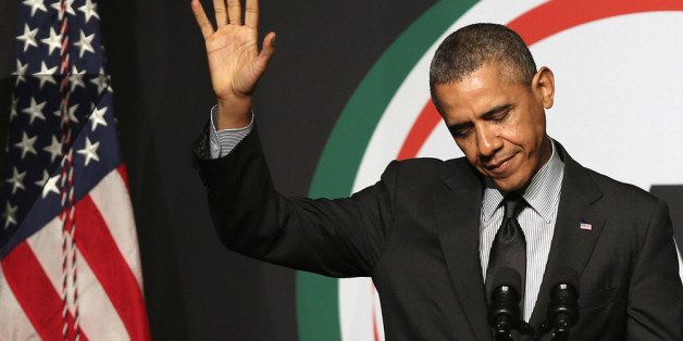 NEW YORK, NY - APRIL 11: U.S. President Barack Obama waves before addressing members of the National Action Network at their 16th annual convention at the Sheraton New York Times Square on April 11, 2014 in New York City. The President spoke about Americans' right to vote, saying state Republican state legislatures nationwide have passed voting fraud laws intended to curb the minority vote. (Photo by John Moore/Getty Images)