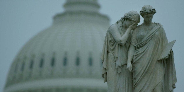 WASHINGTON - OCTOBER 25: A weeping statue stands in front of the U.S. Capitol October 25, 2002 in Washington, DC. U.S. Senator Paul Wellstone (D-MN), along with his wife, daughter and five others, were killed today in a plane crash in northern Minnesota. (Photo by Mark Wilson/Getty Images)