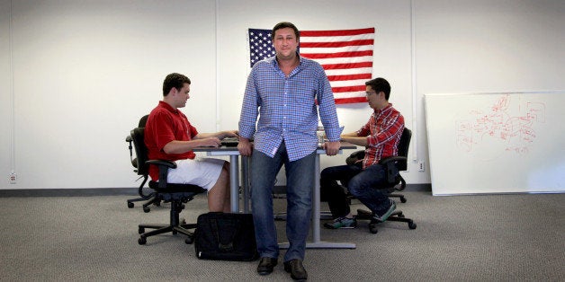 SAN MATEO, CA - JULY 25:Andy Barkett, a former Facebook software engineer, is the new technology officer for the Republican National Committee. He poses for a portrait at his new offices in San Mateo, Calif., on Thursday, July 25, 2013. With him are software engineers Henry Pfirrmann (left) and Newton Der (right).(Photo by Preston Gannaway/For The Washington Post via Getty Images)