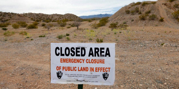 MESQUITE, NV - APRIL 11: A sign sits at the beginning of a road that goes into thousands of acres of Bureau of Land Management land that has been temporarily closed to round-up illegal cattle that are grazing south of Mesquite Nevada on April 11, 2014 in Mesquite, Nevada. BLM officials are rounding up ranchers Cliven Bundy's cattle, who has been locked in a dispute with the BLM for a couple of decades over grazing rights.(Photo by George Frey/Getty Images