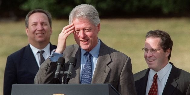 WASHINGTON, : US President Bill Clinton answers a reporters' question after making a statement on US economic growth 12 January, 2001, as Economic Adviser Gene Sperling (R) and US Treasury Secretary Lawrence Summers (L) look on during a press conference on the South Lawn at the White House in Washington, DC. Clinton told reporters the economy is on a solid foundation and that evidence suggests that the expansion will continue in 2001. (FILM) AFP PHOTO/ Mario TAMA (Photo credit should read MARIO TAMA/AFP/Getty Images)