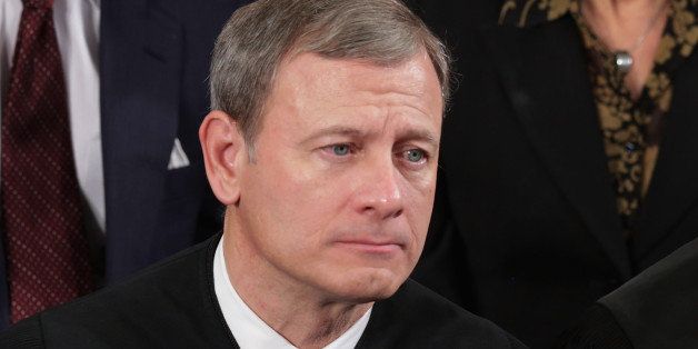 WASHINGTON, DC - JANUARY 28: U.S. Supreme Court Chief Justice John Roberts (L) and Associate Justice Anthony Kennedy listen to President Barack Obama deliver the State of the Union address to a joint session of Congress in the House Chamber at the U.S. Capitol on January 28, 2014 in Washington, DC. In his fifth State of the Union address, Obama is expected to emphasize on healthcare, economic fairness and new initiatives designed to stimulate the U.S. economy with bipartisan cooperation. (Photo by Chip Somodevilla/Getty Images)