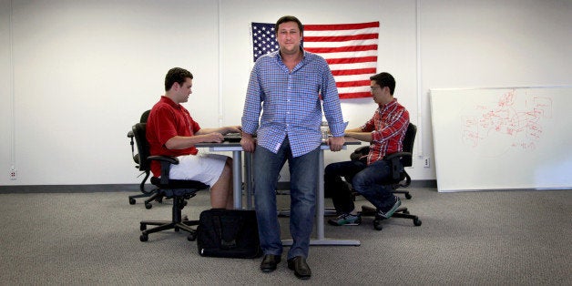 SAN MATEO, CA - JULY 25:Andy Barkett, a former Facebook software engineer, is the new technology officer for the Republican National Committee. He poses for a portrait at his new offices in San Mateo, Calif., on Thursday, July 25, 2013. With him are software engineers Henry Pfirrmann (left) and Newton Der (right).(Photo by Preston Gannaway/For The Washington Post via Getty Images)